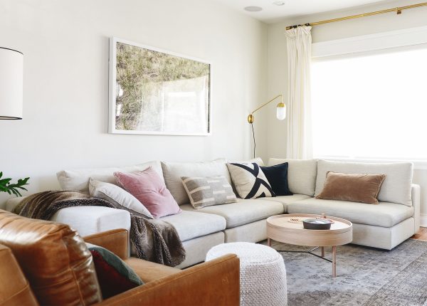 The YellowBrickHome family cuddles up on our Gaba modular sofa in Pearl.