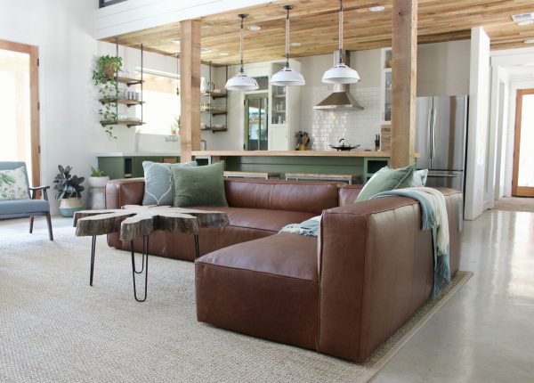 Wow this room has "elegant nap" written all over it. We love the sage green color with our lustrous modular Mello sofa in dark brown.