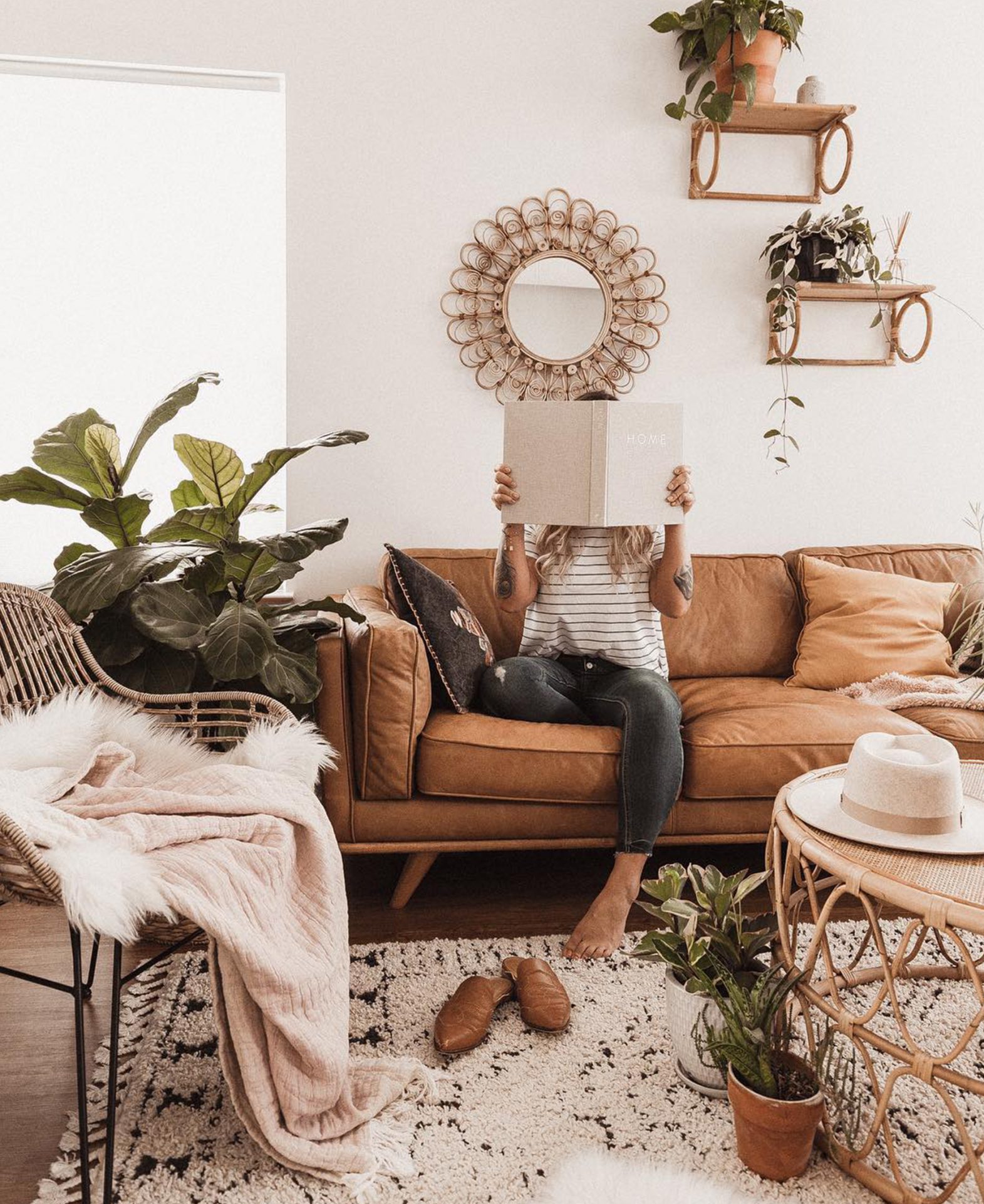 Blogger Shyla Cino sits on Article leather sofa