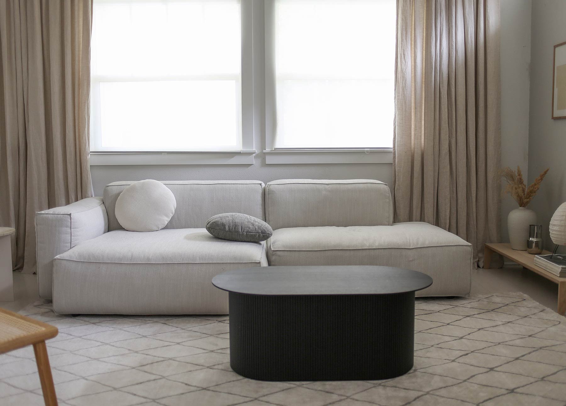 A Merry Mishap shares her white Article Solae sofa in a serene living room.