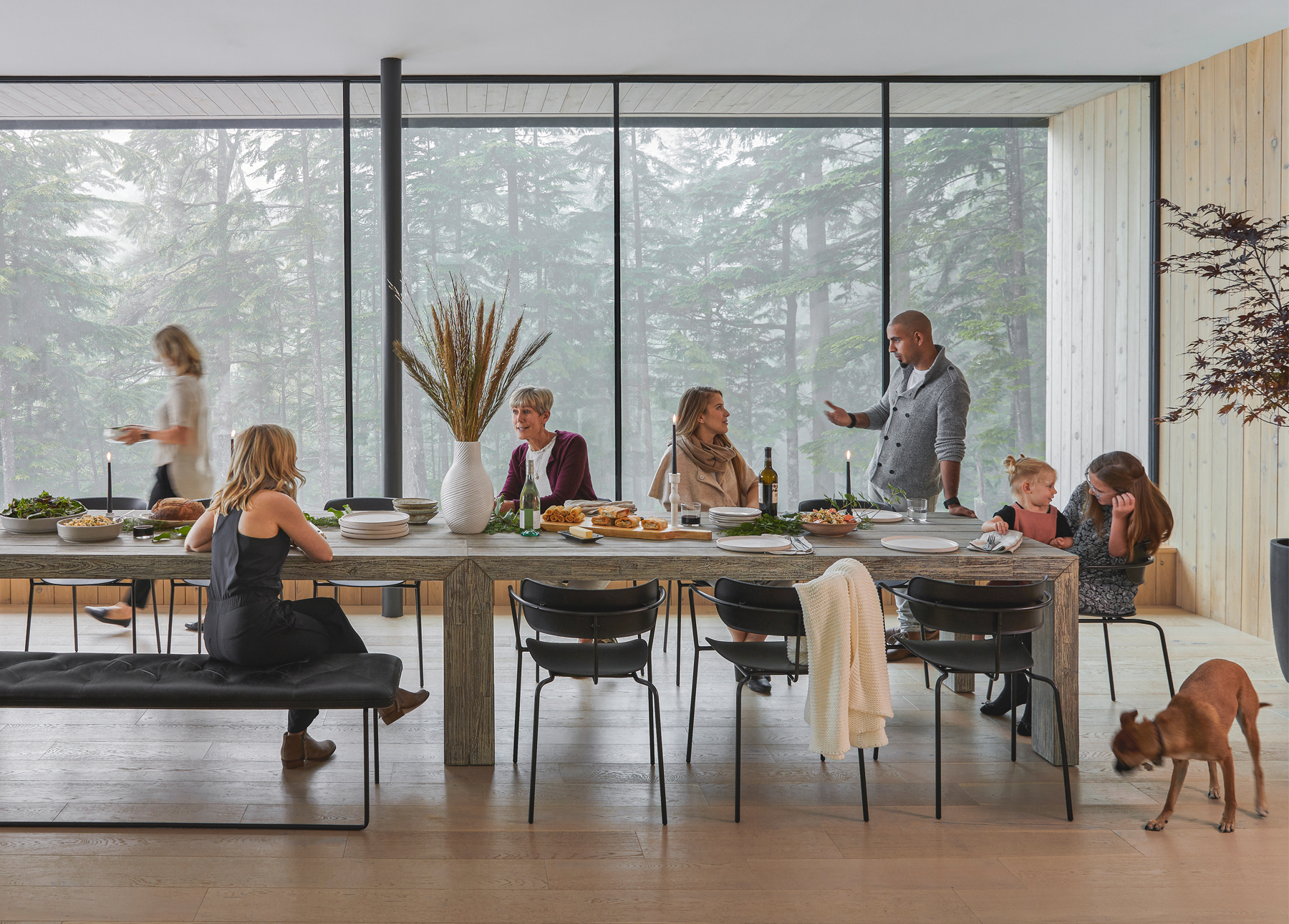 Family and friends eat dinner at the Article Atica dining table