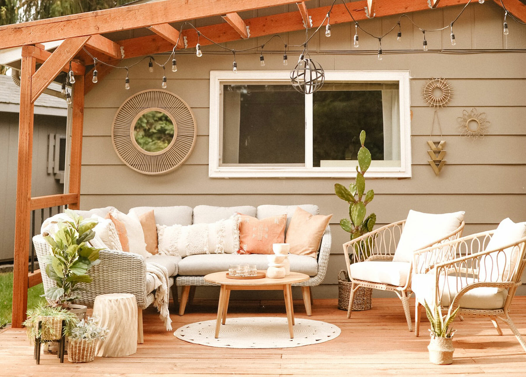 The Ora Sectional sits on a porch with a cedar awning