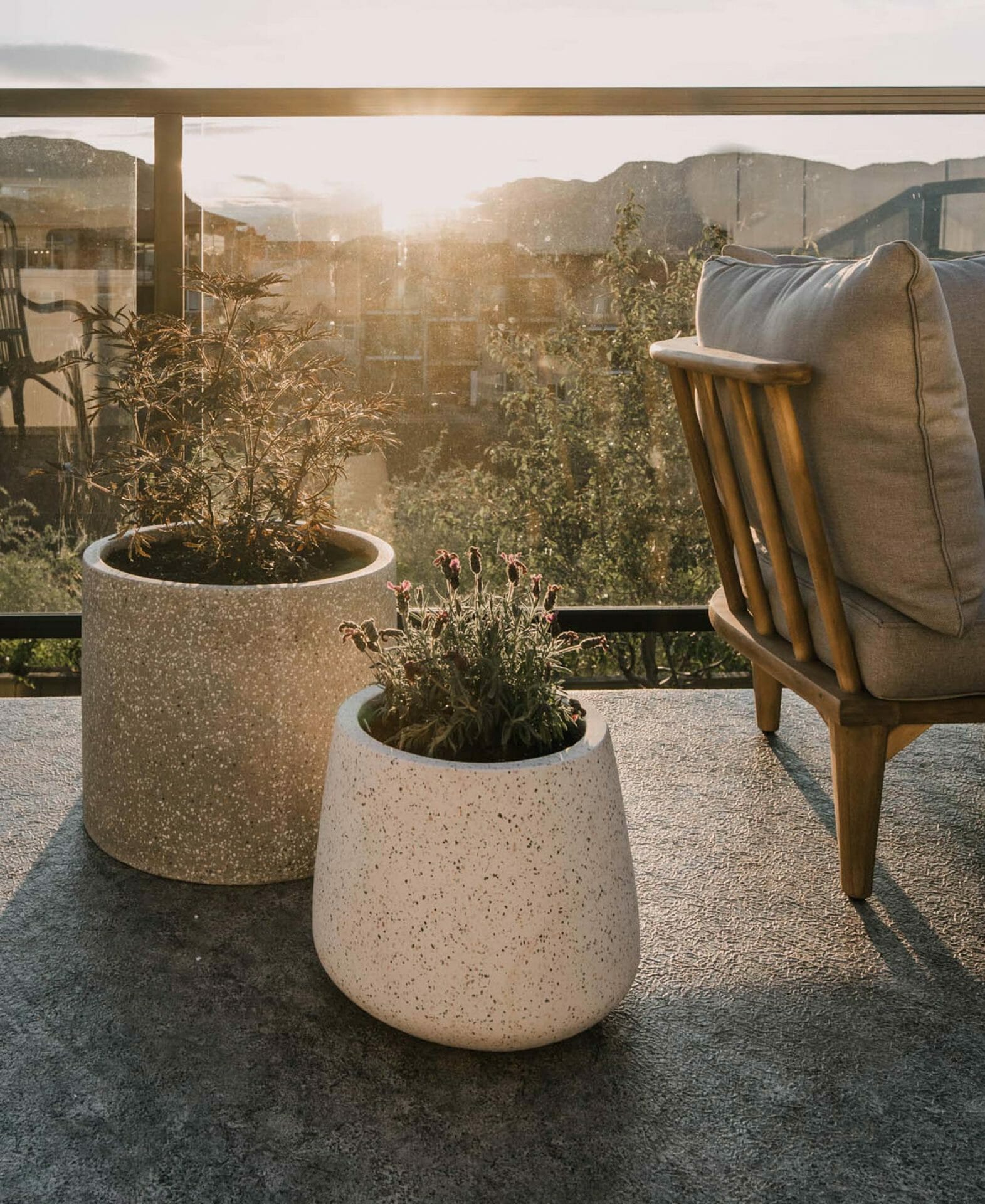 Blogger Lemon Thistle's apartment balcony is seen with two Article terrazzo planters.